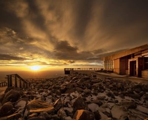 Sunset lights up the deck outside the visitor center.