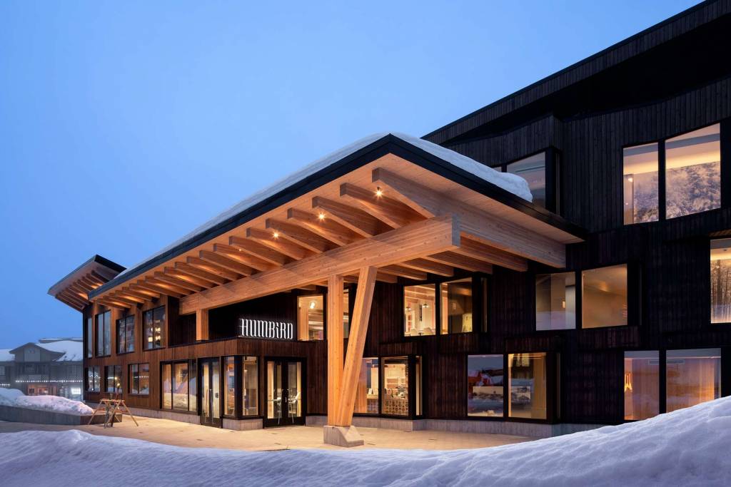 The main entrance is covered with a timber canopy.