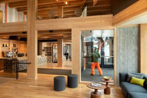 The interior stays true to a familiar and warm lodge aesthetic with the use of exposed mass timber.