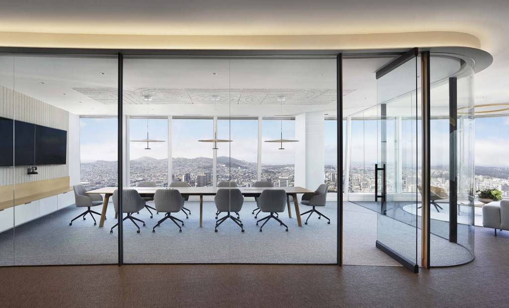 A standout feature is the expansive conference room, featuring three glass walls.