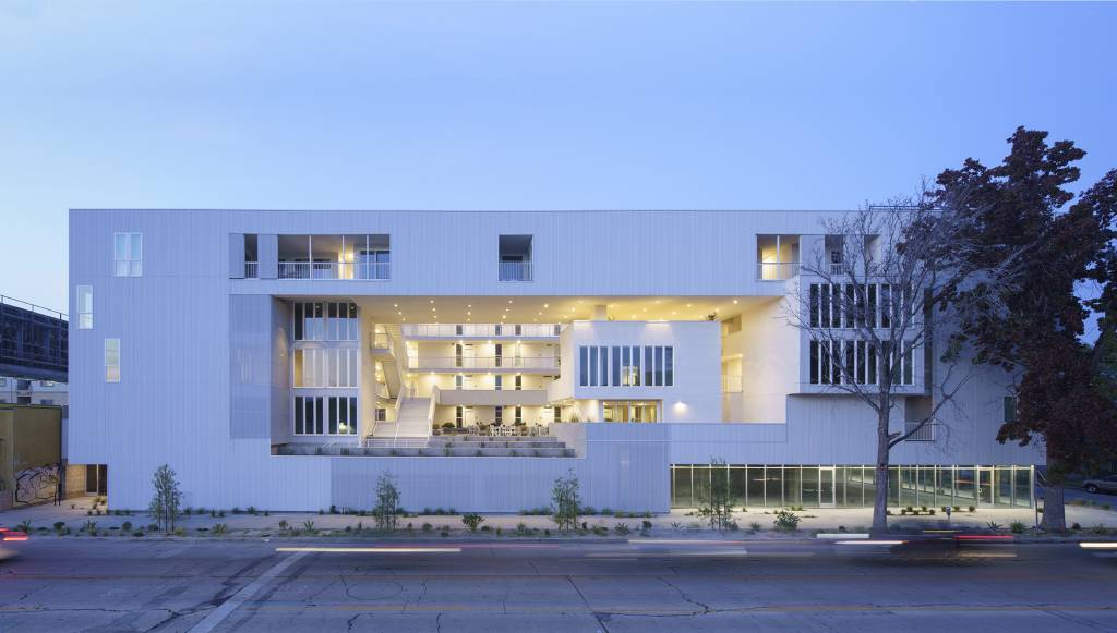 The main street-level view of 11NOHO at night.