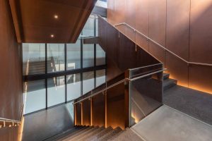 The central staircase connecting three floors of office space.