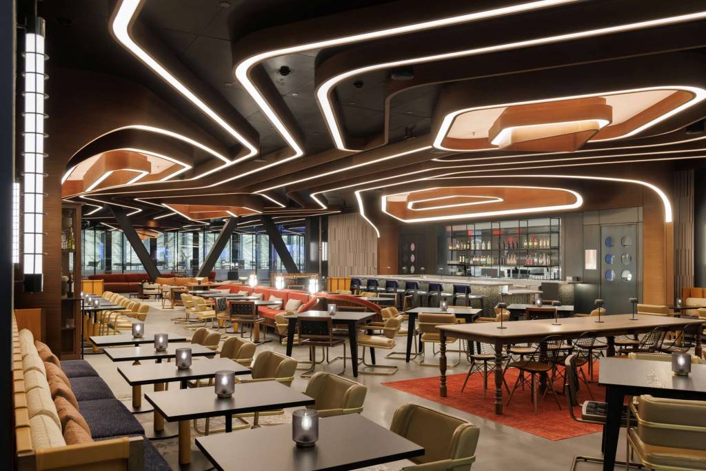 The restaurant and lobby area with the innovative arrangement of ceiling lights, designed by Rockwell Group.