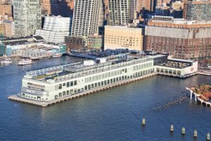 Aerial view of the refurbished Pier 57, listed on the National Register of Historic Places (NRHP). It serves as an office for the anchor tenant Google and features a public place open to New Yorkers.