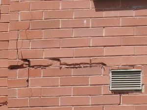 An example of cracked and spalled brick cladding where lipped brick was used along a horizontal expansion joint.