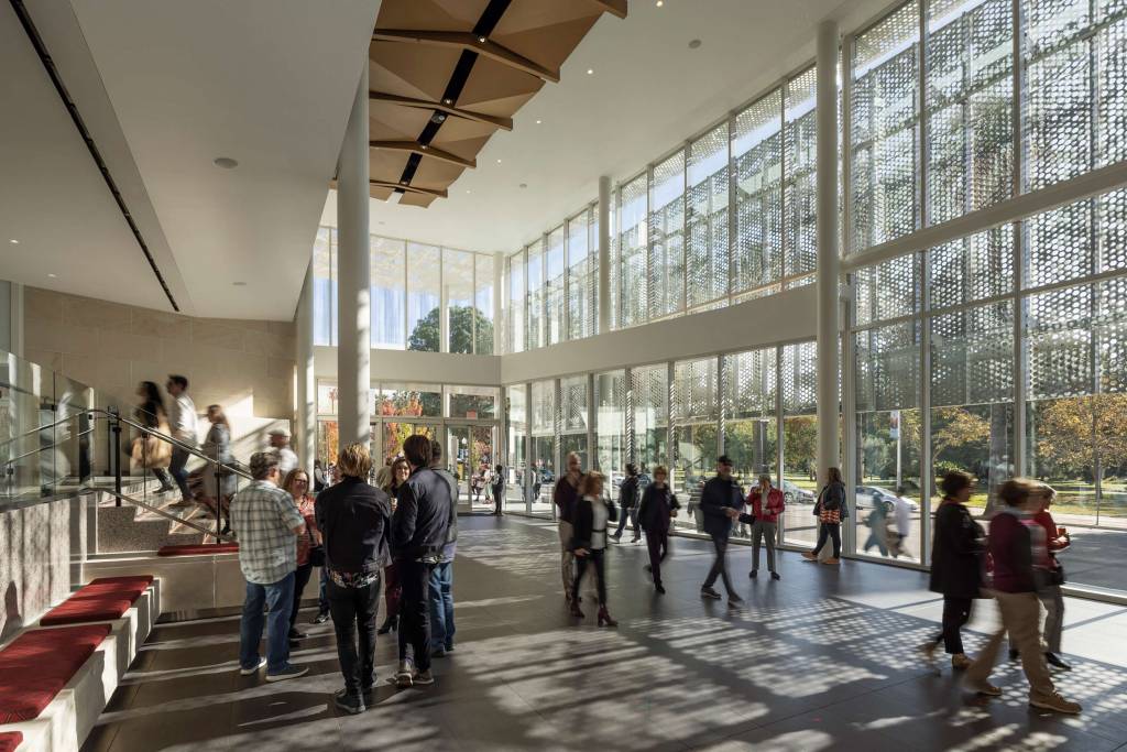 The scrim spanning north to south of the entire entrance of the renovated and expanded SAFE Credit Union Performing Arts Center in Sacramento lets in filtered light.