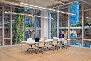 The interior of the building with views of the biophilic exterior wall.