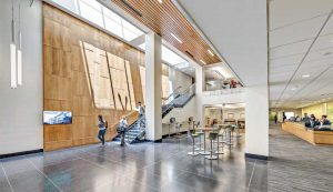 Balancing absorption, reflection, and diffusion for optimal sound quality, enhanced learning, and productivity, while elevating aesthetics though natural wood tones in George Mason University Fenwick Library.