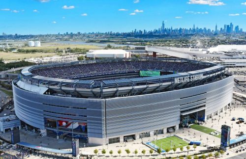 Metlife Stadium with New Jersey city's skyline in the backdrop.