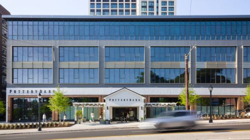 Fully glass building at a slope.