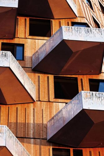 asymmetrical wooden balcony of a wooden building 