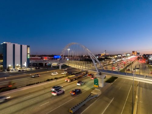 cable bridge at a busy highway