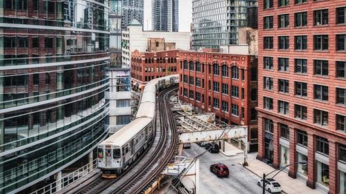 train going through the city scape