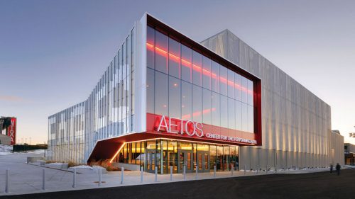 glass exterior building with 'Aetos'