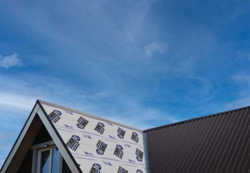 picture of a sky with a bare roof of a house on one side