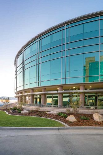 closeup of a circular glass facade on a building