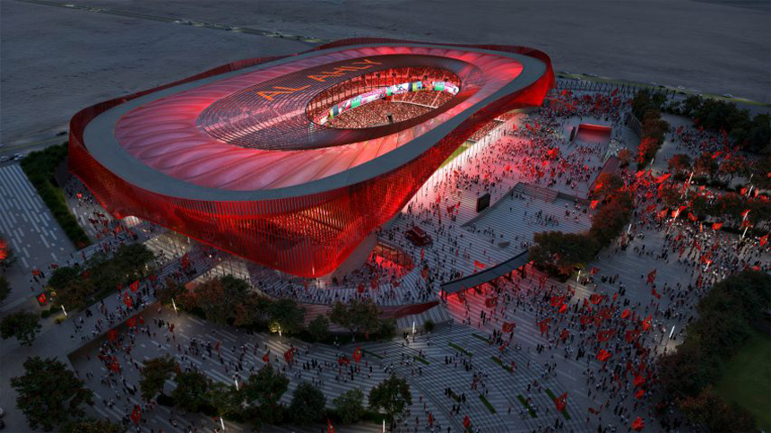 "An illuminated modern stadium with a striking red architectural design, featuring a unique curved shape and an open central area. 